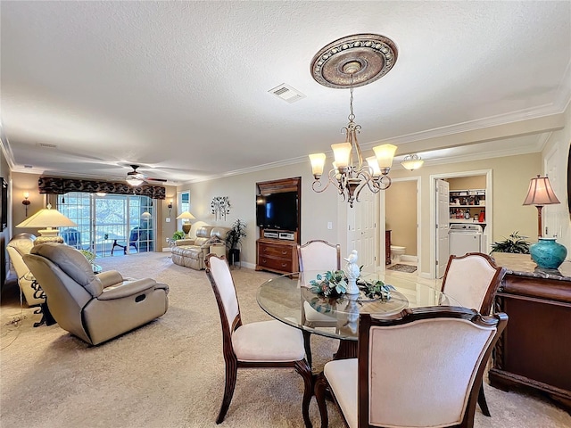 dining area with light carpet, ornamental molding, a textured ceiling, and ceiling fan with notable chandelier