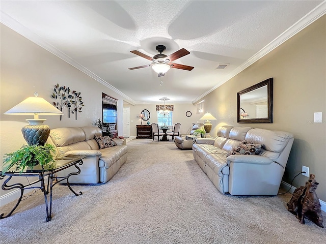 carpeted living room with a textured ceiling, ceiling fan, and crown molding