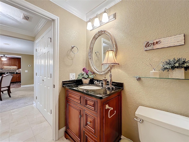 bathroom featuring toilet, vanity, ceiling fan, decorative backsplash, and crown molding