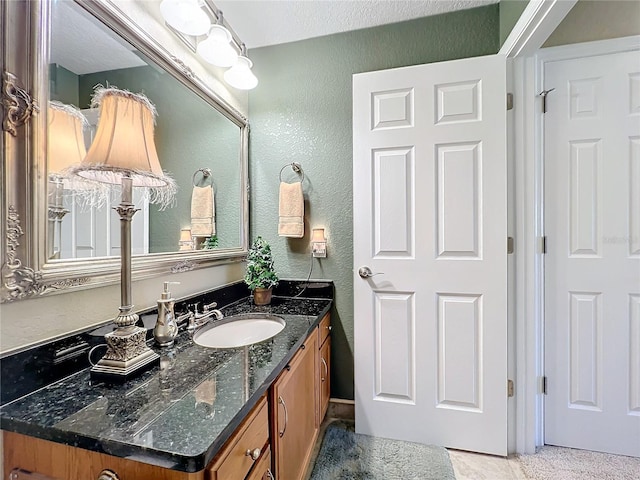 bathroom featuring tile patterned floors and vanity