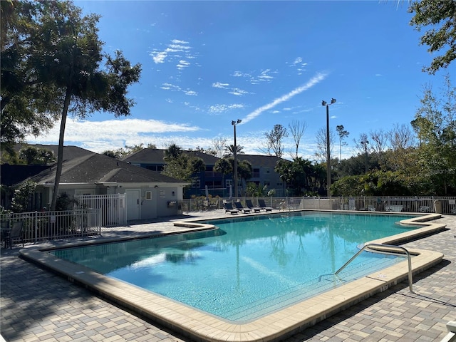 view of swimming pool with a patio area