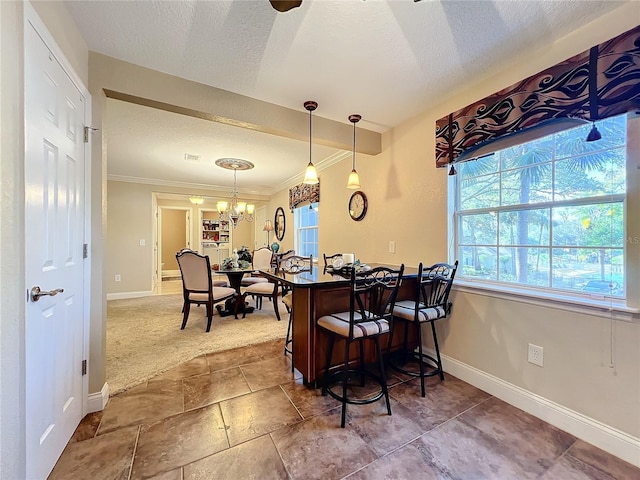 4208 Clubside Dr Unit 4208, Longwood, FL 32779 - dining space with a textured ceiling, baseboards, ornamental molding, and a chandelier