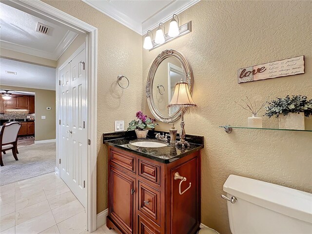 4208 Clubside Dr Unit 4208, Longwood, FL 32779 - half bath featuring ornamental molding, toilet, vanity, a textured wall, and a ceiling fan