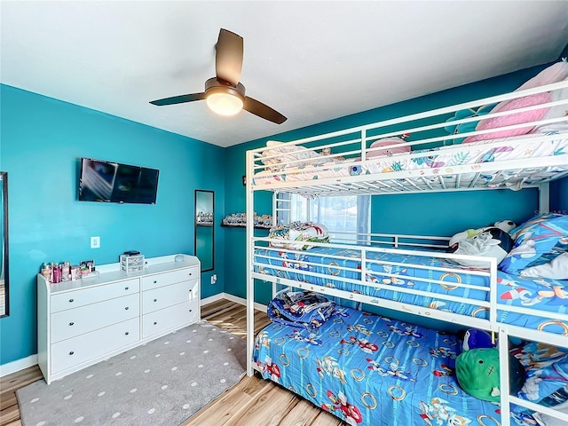 bedroom with hardwood / wood-style flooring and ceiling fan