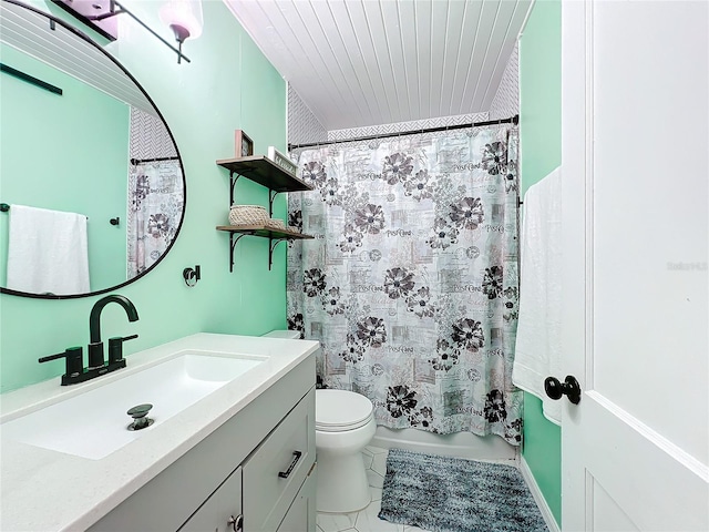 full bathroom featuring vanity, shower / tub combo, tile patterned floors, and toilet