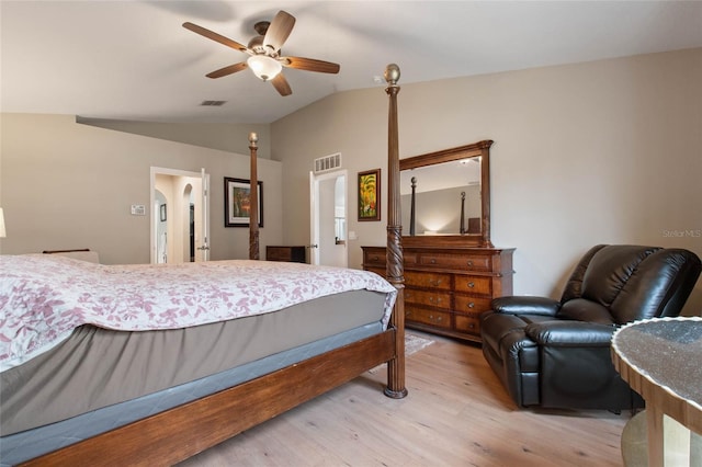 bedroom featuring light wood-type flooring, ceiling fan, and lofted ceiling