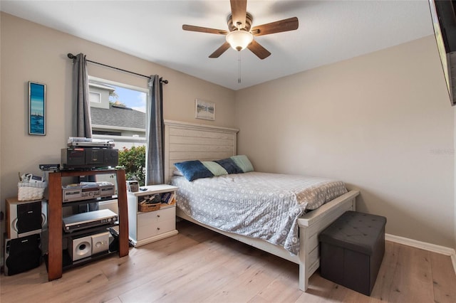 bedroom featuring ceiling fan and light hardwood / wood-style flooring