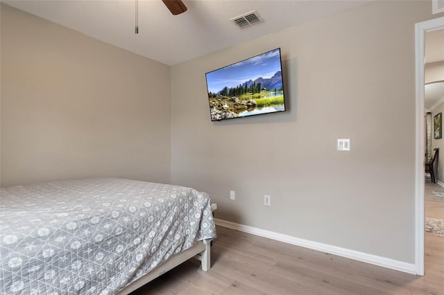 bedroom featuring ceiling fan and light hardwood / wood-style flooring