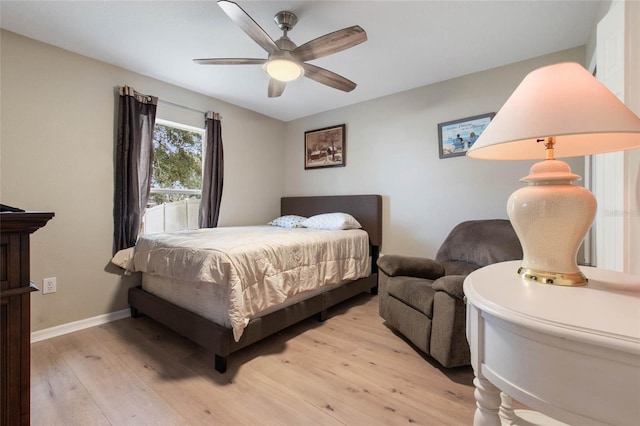 bedroom featuring ceiling fan and light hardwood / wood-style flooring