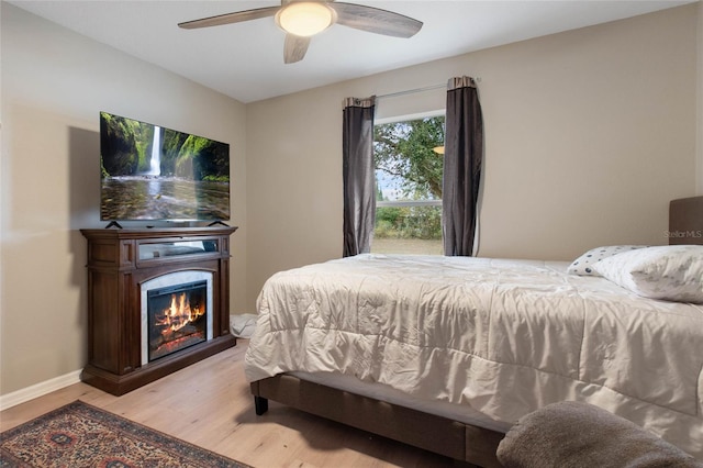 bedroom featuring ceiling fan and light hardwood / wood-style floors