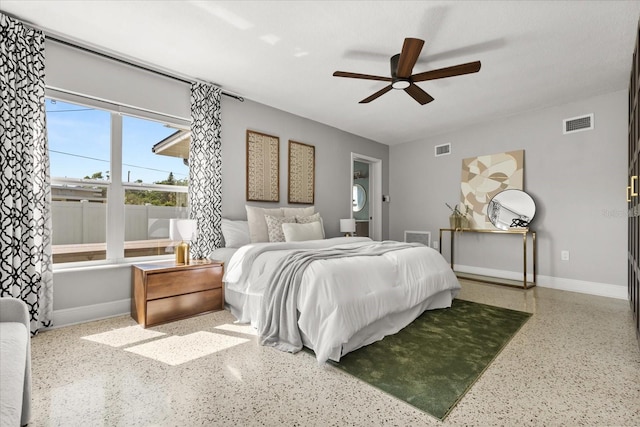 bedroom featuring speckled floor, baseboards, and a ceiling fan