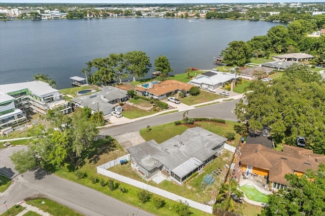 aerial view of residential area featuring a nearby body of water