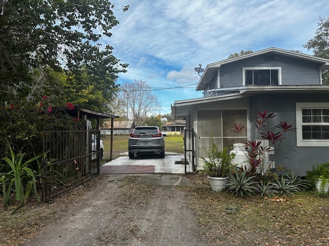 view of home's exterior with a sunroom