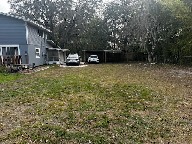 view of yard with a carport