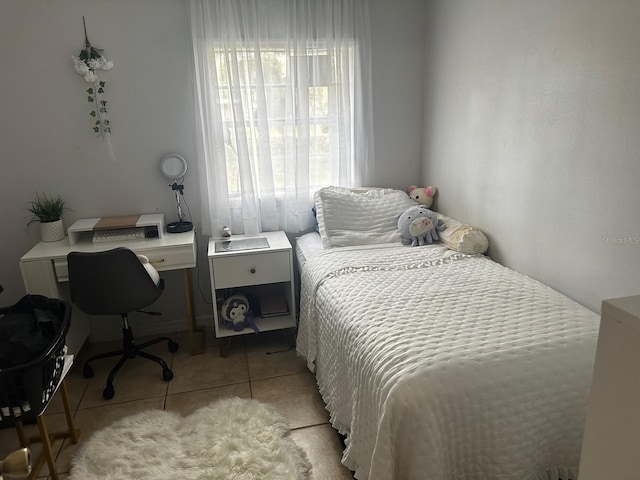 bedroom with light tile patterned flooring