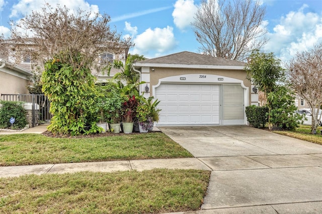 view of front of property with a garage and a front yard