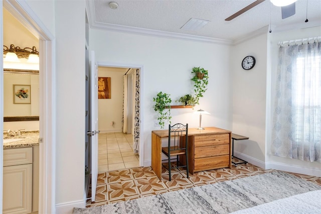 interior space featuring ceiling fan, a textured ceiling, and ornamental molding