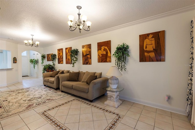 living room featuring a textured ceiling, light tile patterned floors, crown molding, and an inviting chandelier