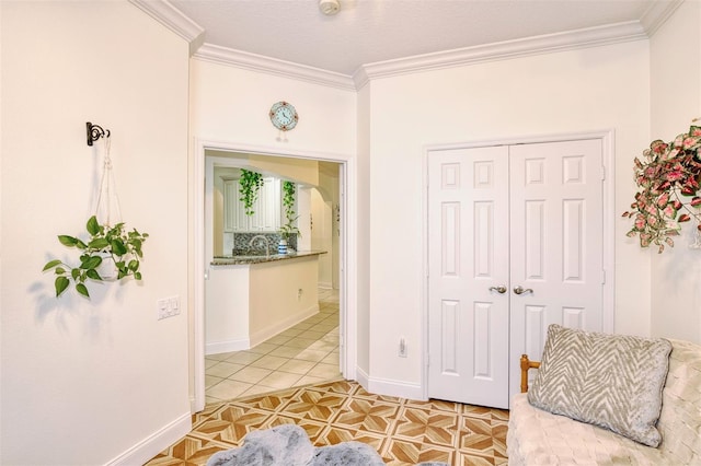 living area featuring ornamental molding and light tile patterned flooring