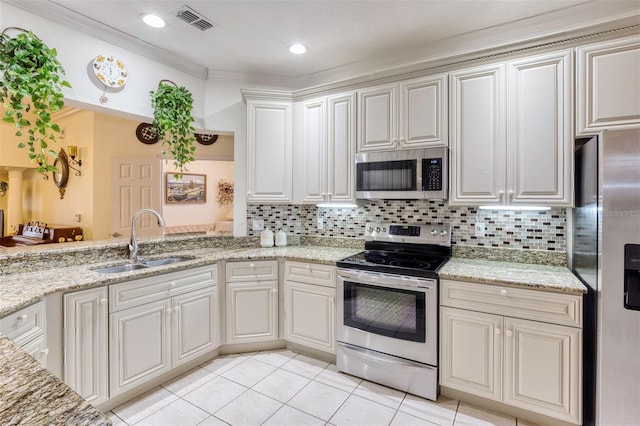 kitchen featuring appliances with stainless steel finishes, sink, backsplash, ornamental molding, and light tile patterned flooring