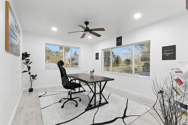 office featuring light wood-type flooring and ceiling fan