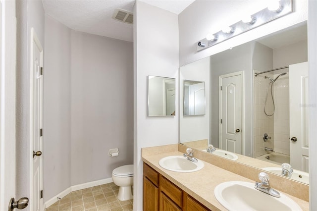 full bathroom featuring toilet, vanity, and tub / shower combination