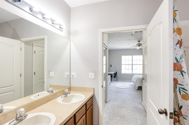 bathroom featuring ceiling fan and vanity