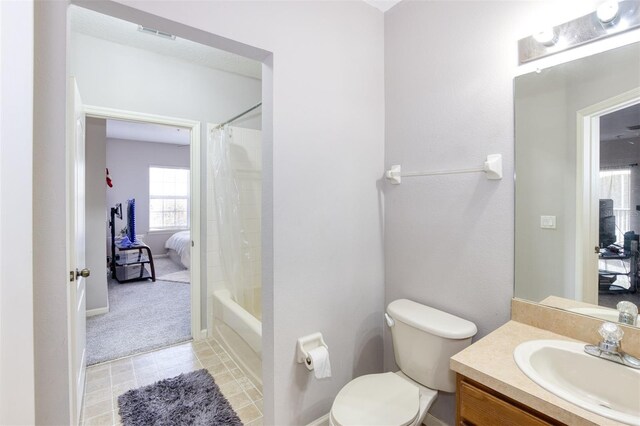 full bathroom with toilet, vanity, and shower / tub combo with curtain