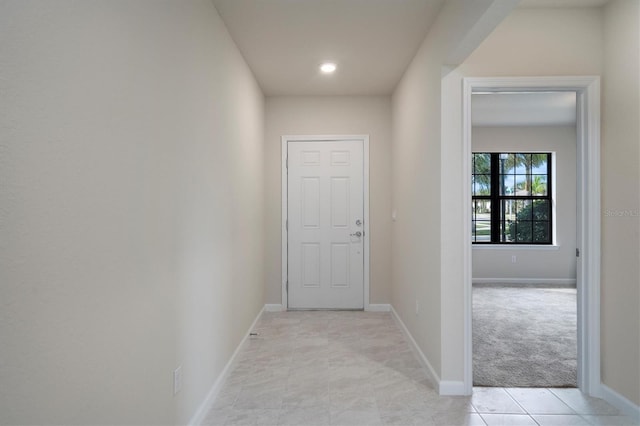 hallway with light carpet