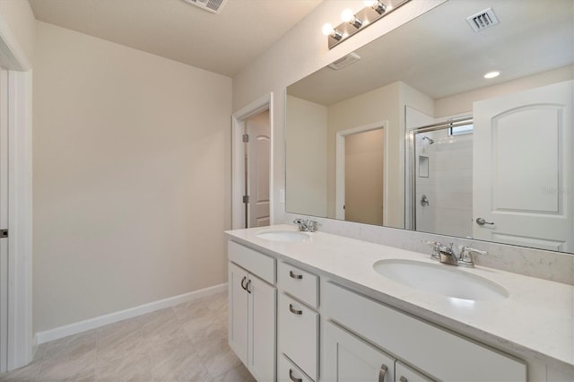 bathroom with walk in shower and vanity