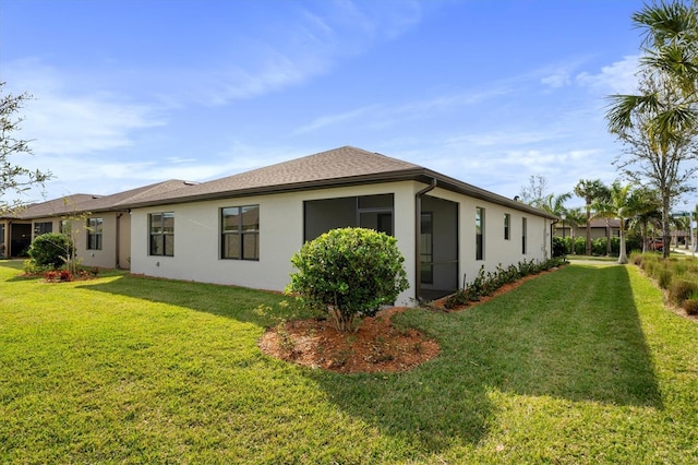 view of side of property with a yard