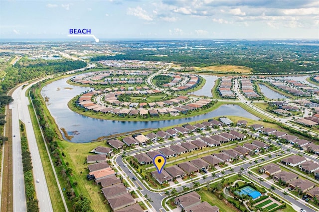 birds eye view of property featuring a water view