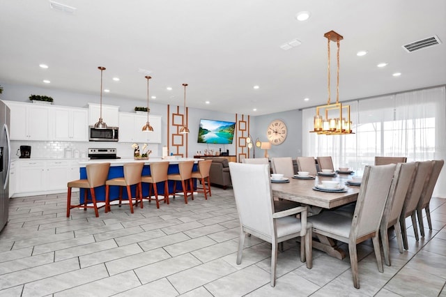 dining room featuring a chandelier