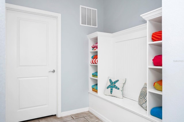 mudroom with light tile patterned flooring