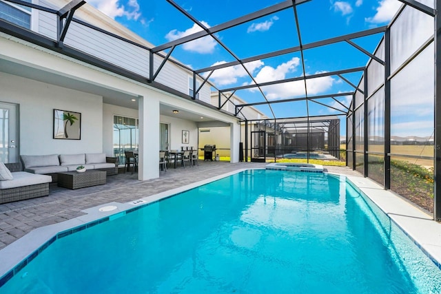 view of swimming pool featuring a patio area, grilling area, glass enclosure, an in ground hot tub, and an outdoor living space