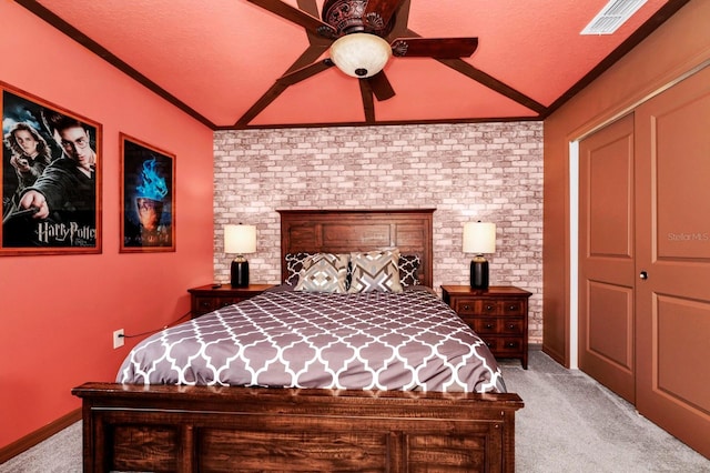 bedroom with ceiling fan, ornamental molding, a textured ceiling, light carpet, and vaulted ceiling