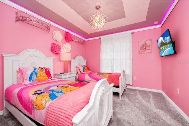 bedroom featuring a raised ceiling, carpet, and a notable chandelier