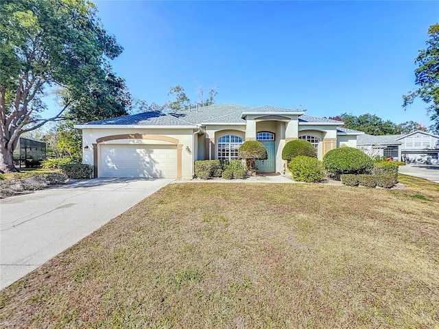 view of front of house featuring a garage and a front yard