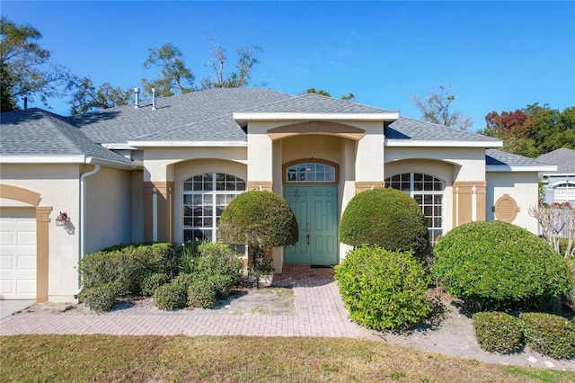 view of front of home with a garage