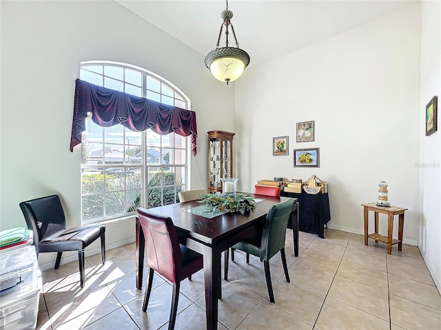 dining area with light tile patterned floors