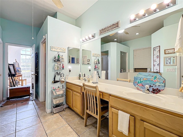 bathroom with ceiling fan, tile patterned floors, and vanity