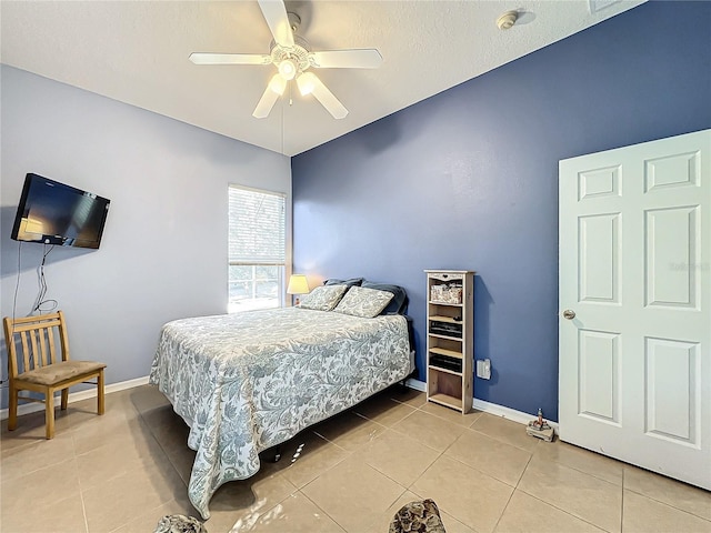 bedroom featuring ceiling fan and tile patterned floors