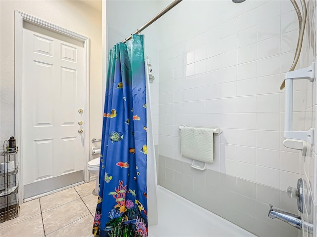 bathroom featuring tile patterned floors, toilet, and shower / bath combination with curtain