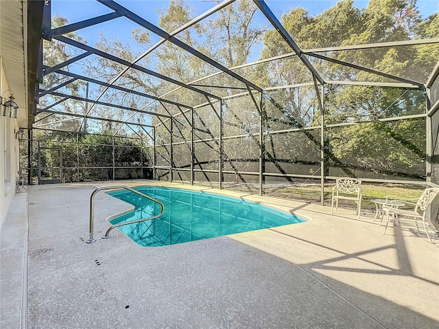 view of swimming pool with a lanai and a patio