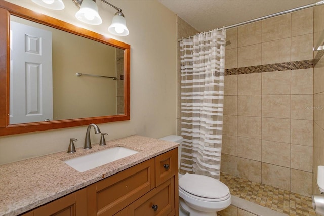 bathroom featuring curtained shower, toilet, and vanity