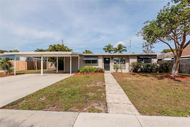 single story home with a carport and a front yard