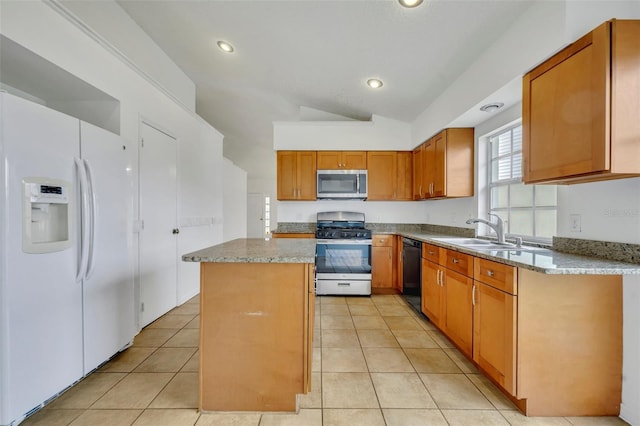 kitchen featuring stainless steel appliances, a center island, lofted ceiling, light stone counters, and sink