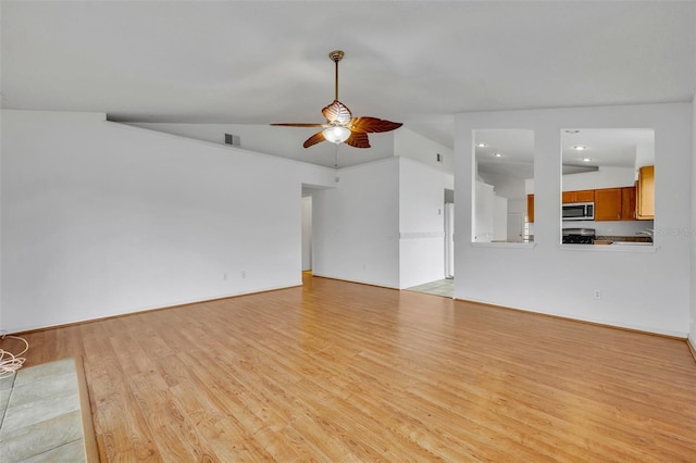 unfurnished living room with light hardwood / wood-style floors, lofted ceiling, and ceiling fan