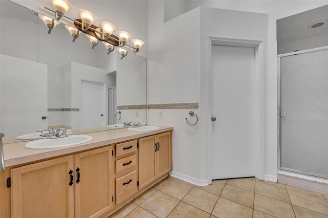 bathroom featuring a shower with door, tile patterned floors, and vanity