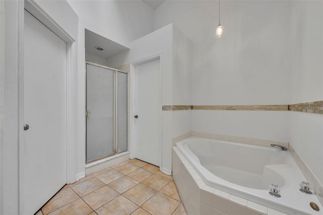 bathroom featuring independent shower and bath and tile patterned flooring